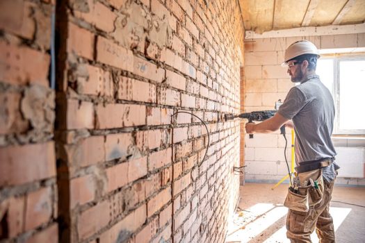 handyman-construction-site-process-drilling-wall-with-perforator_169016-12122